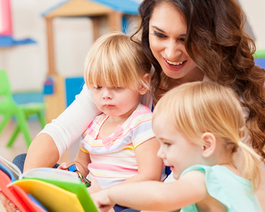 Toddlers building early math skills with hands-on manipulatives.