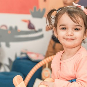 Toddler engaging in independent play in the classroom.