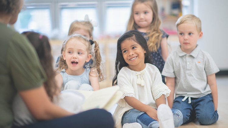 Children listening to teacher-led story time.