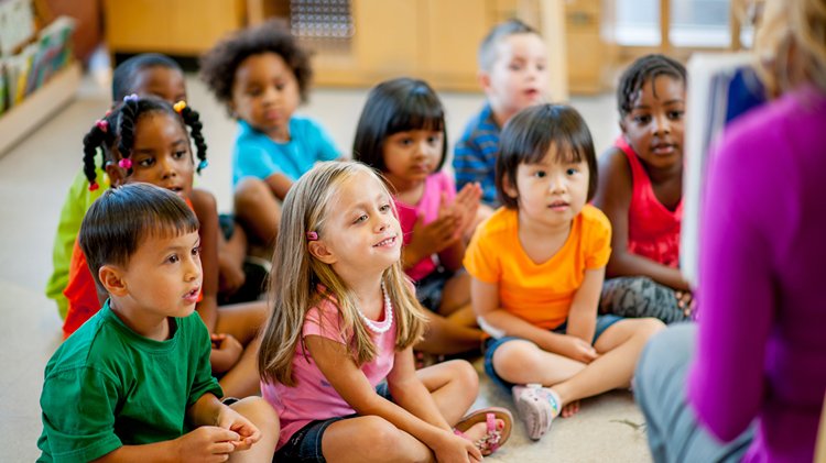 Children engaged in circle time with their teacher.