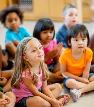 Children participating in group learning during circle time.