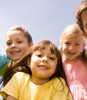 School-age children building friendships during group time.