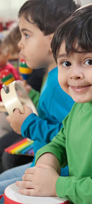 School-age child participating in a music activity.
